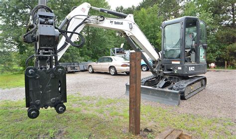 post pounder for bobcat mini excavator|excavator leveling post pounder.